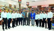 Bekal Mohamed Salih (centre), Managing Director, Bombay Silk Centre and Chairman of BMS Exports (Mumbai), India, with Vipresh Seth (sixth right), General Manager, BSC, and some of the employees of BSC at the showroom.  Pics: Salim Matramkot / The Peninsul
