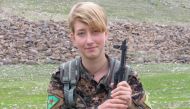A picture made available by the Women's Protection Units (YPJ) Press office on March 19, 2018, shows British YPJ fighter Anna Campbell posing for a picture at an undisclosed location.
