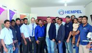 The staff of Hempel Paints during the opening of its newest multi-tint centre in Abu Hamour. 