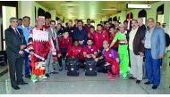 Qatar football players and officials pose for a photograph with Iraq Football Association (IFA) officials and fans upon arrival in Basra yesterday ahead of their matches against Iraq and Syria yesterday. 