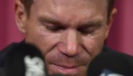 Australian cricketer David Warner cries during a press conference at the Sydney Cricket Ground (SCG) in Sydney on March 31, 2018, after his return from South Africa. AFP / PETER PARKS