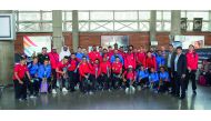Al Rayyan players, officials and supporing staff pose for a photograph upon their arrival in Tehran on the eve of  their AFC Champions League clash against Esteghlal.