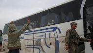 A Syrian kid gestures with victory sign as 17th convoy of vehicles, carrying civilians from Syria’s Eastern Ghouta district, arrive in Al-Bab district, in Aleppo in Syria on April 10, 2018. Beha el Halebi - Anadolu
