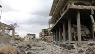 Destruction is seen in the former rebel-held town of Saqba in the Eastern Ghouta region on the outskirts of the Syrian capital Damascus on April 10, 2018. / AFP / STRINGER