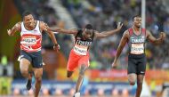 (From L) England’s Zharnel Hughes, Trinidad And Tobago’s Jereem Richards and Canada's Aaron Brown cross the finish line of the athletics men's 200m final during the 2018 Gold Coast Commonwealth Games at the Carrara Stadium on the Gold Coast on April 12, 2
