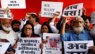People shout slogans and hold placards during a protest against the rape of an eight-year-old girl, in Kathua, near Jammu and a teenager in Unnao, Uttar Pradesh state, in Mumbai, India April 13, 2018. REUTERS/Francis Mascarenhas