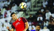 Al Rayyan’s Qatari forward Sebastian Soria (left) leaps for the ball during the Asian Champions League football match at Jassim Bin Hamad Stadium in Doha yesterday.