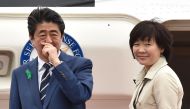 Japan's Prime Minister Shinzo Abe and his wife Akie depart for the US from Tokyo's Haneda airport on April 17, 2018. AFP / Kazuhiro Nogi 