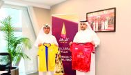 Officials of Al Gharafa and Al Duhail display the team jerseys after the Qatar Cup technical meeting yesterday.
