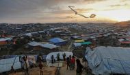 Rohingya refugee children fly improvised kites at the Kutupalong refugee camp near Cox's Bazar, Bangladesh December 10, 2017. Reuters/Damir Sagolj