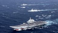File photo of China's aircraft carrier with accompanying fleet conducts a drill in the South China Sea. Reuters
