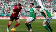 Celtic’s James Forrest in action with Hibernian’s Danny Swanson and Lewis Stevenson REUTERS/Russell Cheyne