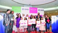 Officials, judges and winners during the QNB-Babyshop drawing competition ‘Expressions’ held at Alasmakh Mall yesterday. Pic: Baher Amin / the peninsula