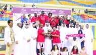 Al Arabi’s players and officials celebrate after winning the Emir Cup basketball final against Al Wakrah yesterday. 
