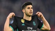 Real Madrid's Spanish midfielder Marco Asensio celebrates after scoring a goal during the UEFA Champions League semi-final first-leg football match FC Bayern Munich v Real Madrid CF in Munich in southern Germany on April 25, 2018. AFP / Christof Stache 
