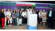 AWAQ members with QSE officials at Qatar Stock Exchange premises.
