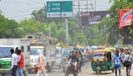Indian commuters drive along a busy road as pedestrians try to cross a zebra crossing in the city of Kanpur of the northern Indian state of Uttar Pradesh on May 2, 2018.  AFP