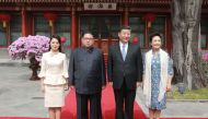 China President Xi Jinping his wife Peng Liyuan North Korean leader Kim Jong Un and his wife Ri Sol Ju posing for a picture in Beijing on March 27 2018 AFP KCNA via KNS