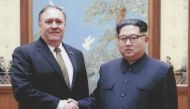 File photo released by the US Government on April 26, 2018, North Korean leader Kim Jong-Un (R) shakes hands with the former CIA Director, now US Secretary of State, Mike Pompeo in Pyongyang over the 2018 Easter weekend. AFP PHOTO / US Government/ HO 