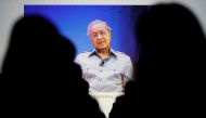 Malaysia's Prime Minister Mahathir Mohamad is seen on video conference screen during the Wall Street Journal CEO Conference in Tokyo, Japan May 15, 2018. REUTERS/Tor