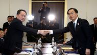 FILE PHOTO: South Korea's Unification Minister Cho Myoung-gyon shakes hands with Ri Son Gwon, chairman of North Korea's ÔCommittee for the Peaceful Reunification of the country', as they exchange documents after their meeting at the truce village of Panmu