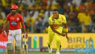 Kings XI Punjab cricketer KL Rahul (L) looks on as Chennai Super Kings cricketer Lungi Ngidi bowls during the 2018 Indian Premier League (IPL) Twenty20 cricket match between Chennai Super Kings and Kings XI Punjab at the Maharashtra Cricket Association St