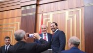 Lebanon's Finance Minister Ali Hassan Khalil takes photos of the parliamentary re-elected speaker Nabih Berri with outgoing Prime Minister Saad al-Hariri at the parliament in Beirut, Lebanon May 23, 2018. Lebanese Parliament
