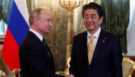 Russian President Vladimir Putin shakes hands with Japanese Prime Minister Shinzo Abe during their meeting at the Kremlin in Moscow, Russia May 26, 2018. REUTERS/Grigory Dukor
