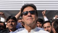 Pakistan opposition leader and head of the Pakistan Tehreek-e-Insaf (PTI - Pakistan Movement for Justice) political party Imran Khan leaves Parliament after attending a session in Islamabad on May 23, 2018. AFP / AAMIR QURESHI