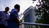 In this file photo taken on May 2, 2018 The ZTE logo is seen on a building in Beijing. / AFP / WANG ZHAO 