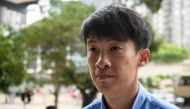 Disqualified lawmaker Baggio Leung arrives at the Kowloon City Magistrates Court in Hong Kong on June 4, 2018, for his sentencing after he was found guilty of unlawful assembly. / AFP / Anthony WALLACE 