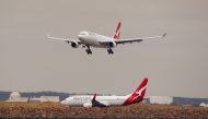 FILE PHOTO: A Qantas plane lands at Kingsford Smith International Airport in Sydney, Australia, February 22, 2018. REUTERS/Daniel Munoz/File Photo