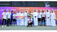 The winners pose with officials of Aspire Zone Foundation at the 7th edition of Ramadan Sports Festival closing ceremony.