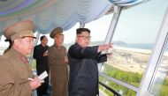 FILE PHOTO North Korean leader Kim Jong Un inspects the construction site of the Wonsan-Kalma coastal tourist area as Kim Su-gil (3rd L), newly appointed director of the General Political Bureau of the Korean People's Army, looks on, in this undated photo