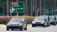 A motorcade believed to be carrying North Korea's leader Kim Jong Un travels past in Singapore June 10, 2018. REUTERS/Athit Perawongmetha