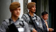 FILE PHOTO: Gurkha policemen stand guard at the venue of the 16th IISS Shangri-La Dialogue in Singapore June 2, 2017. REUTERS/Edgar Su/File Photo