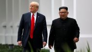 US President Donald Trump and North Korean leader Kim Jong Un walk after lunch at the Capella Hotel on Sentosa island in Singapore June 12, 2018. REUTERS/Jonathan Ernst