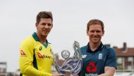Australia's Tim Paine and England's Eoin Morgan pose with the trophy Action Images via Reuters/Paul Childs

