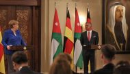 German Chancellor Angela Merkel (L) speaks during a press conference with Jordan's King Abdullah II at the Royal Palace in the Jordanian capital Amman on June 21, 2018. AFP / Khalil Mazraawi