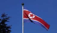 File photo of a North Korean flag flies on a mast at the Permanent Mission of North Korea in Geneva October 2, 2014. REUTERS/Denis Balibouse/File Photo