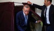 Turkish President Tayyip Erdogan leaves the voting booth at a polling station in Istanbul, Turkey June 24, 2018. REUTERS/Umit Bektas