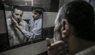 Syrian Muhammed Bessam El Meydani, who lost his eyes by shrapnel pieces during Assad Regime's airstrikes before he left Eastern Ghouta to reach Idlib's rurals, is being shaved in Hatay, Turkey on June 21, 2018. Cem Genco - Anadolu 