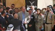 Britain's Prince William (4th-R) visits the West Bank city of Ramallah on June 27, 2018. The Duke of Cambridge is the first member of the royal family to make an official visit to the Jewish state and the Palestinian territories.  AFP / Ahmad Gharabli