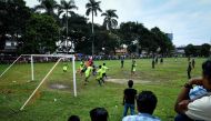 This picture taken on June 17, 2018 shows Rohingya residents watching Rohingya FC and Cheras Harimau teams play during a three-day tournament for refugees, marking the Eid al-Fitr Islamic festival, on the outskirts of Kuala Lumpur.  AFP / Lillian SUWANRUM