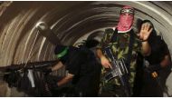 File photo: A Palestinian fighter from the Iz al-Din al-Qassam Brigades, the armed wing of the Hamas movement, gestures inside an underground tunnel in Gaza, August 18, 2014. (Reuters)