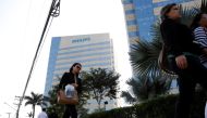 People walk past the Philips headquarters in Barueri, on the outskirts of Sao Paulo, Brazil July 4, 2018. (REUTERS/Nacho Doce)