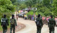 Thai military paramedics head the road to Tham Luang cave area while divers evacuate some of the 12 boys and their coach trapped in the flooded cave in Khun Nam Nang Non Forest Park in the Mae Sai district of Chiang Rai province on July 8, 2018.  AFP / Ta