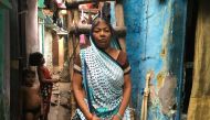 Sushila Devi, who lost her son and husband in a water dispute, poses for a photo outside her one-room shanty in Delhi, India, June 26, 2018. Thomson Reuters Foundation/Annie Banerji