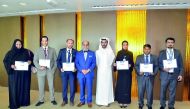Doha Bank’s Group CEO Dr R Seetharaman (fourth left) with recepients of the ‘May 2018 Recognition Awards’ ceremony at Doha Bank tower.