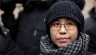 FILE PHOTO - Liu Xia, the wife of Chinese dissident Liu Xiaobo, talks to the media in Beijing February 11, 2010. REUTERS/Nir Elias/File Photo